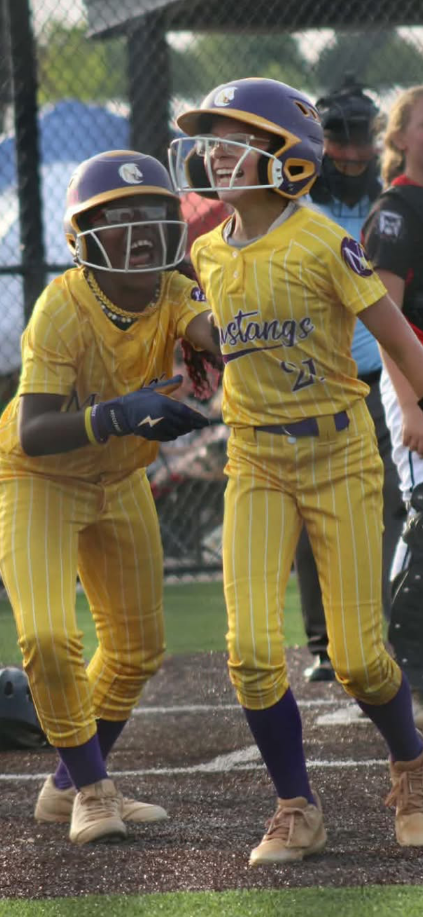 Kelsie and Anaya celebrating together during a Mustangs game